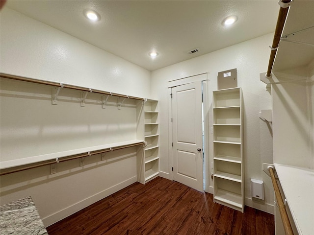 14912 Diamondhead Rd, Conroe, TX 77356 - walk in closet featuring dark wood finished floors