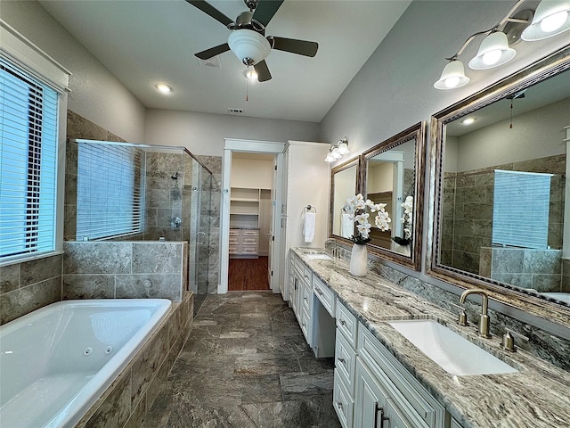 14912 Diamondhead Rd, Conroe, TX 77356 - full bath featuring a shower stall, double vanity, a jetted tub, ceiling fan, and stone finish flooring
