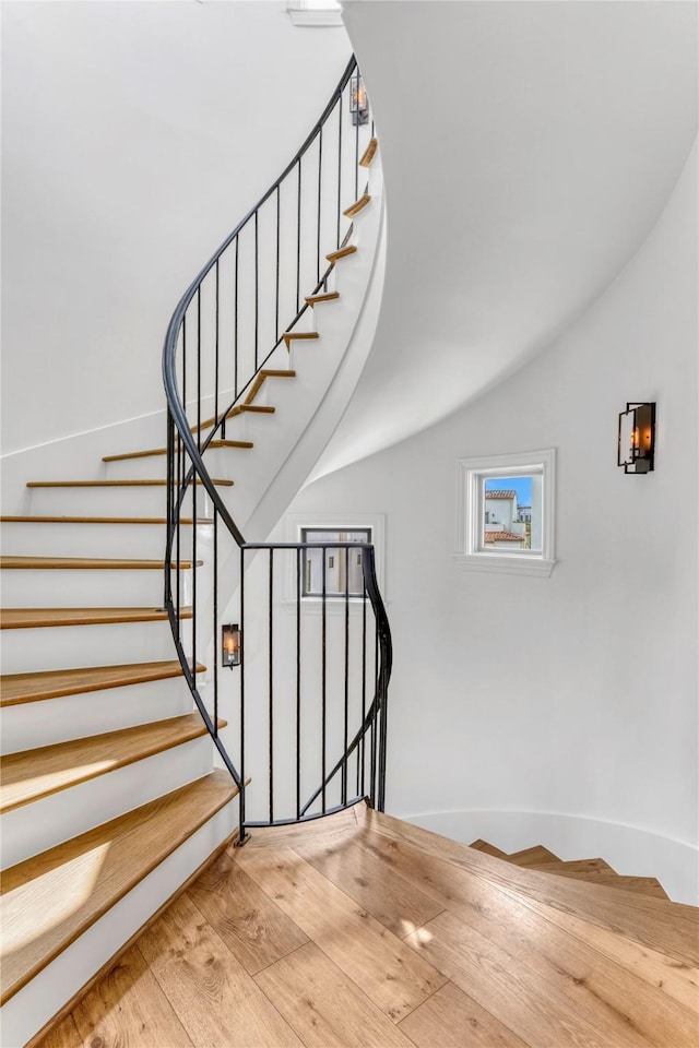 5219 Calle Cordoba Pl, Houston, TX 77007 - staircase featuring wood finished floors and lofted ceiling