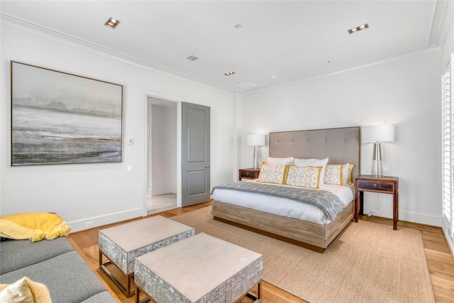 5219 Calle Cordoba Pl, Houston, TX 77007 - bedroom with crown molding and light wood-style flooring