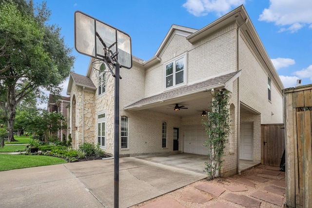 4925 Pine St, Bellaire, TX 77401 - view of front of house featuring an attached garage, brick siding, concrete driveway, and stone siding