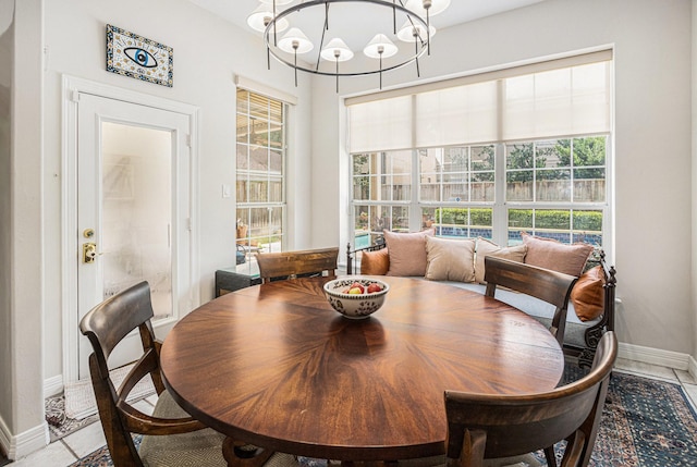 4925 Pine St, Bellaire, TX 77401 - dining room with a chandelier and plenty of natural light