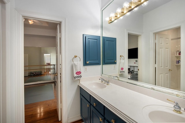 4925 Pine St, Bellaire, TX 77401 - full bath with double vanity and wood finished floors