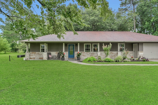 12626 Woodcreek Dr, Willis, TX 77318 - ranch-style home with stone siding, a front yard, an attached garage, and roof with shingles