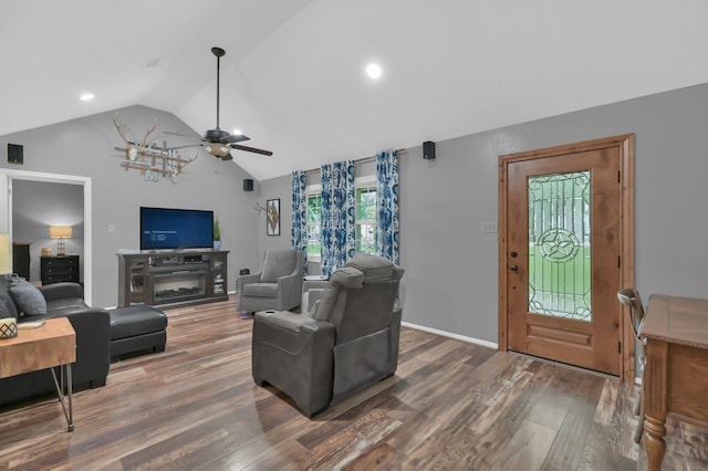 12626 Woodcreek Dr, Willis, TX 77318 - living area featuring vaulted ceiling, wood finished floors, a ceiling fan, and recessed lighting