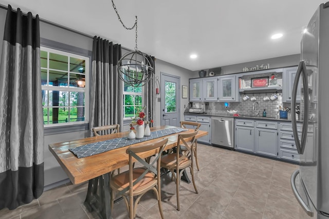 12626 Woodcreek Dr, Willis, TX 77318 - dining area featuring recessed lighting, wet bar, and light tile patterned floors
