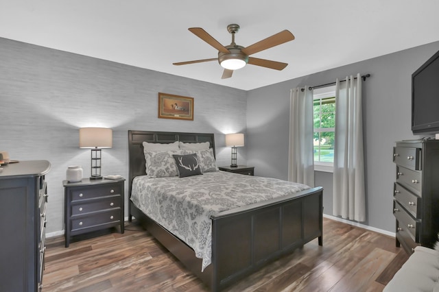 12626 Woodcreek Dr, Willis, TX 77318 - bedroom with wood finished floors and a ceiling fan
