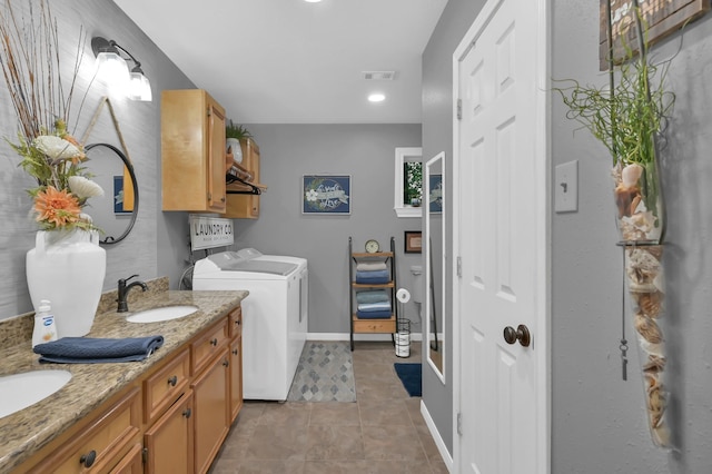 12626 Woodcreek Dr, Willis, TX 77318 - laundry room with separate washer and dryer and light tile patterned floors
