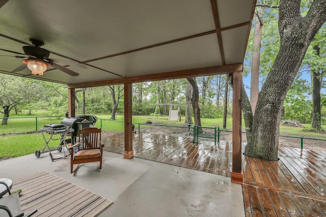 12626 Woodcreek Dr, Willis, TX 77318 - view of patio / terrace with ceiling fan, view of scattered trees, and area for grilling