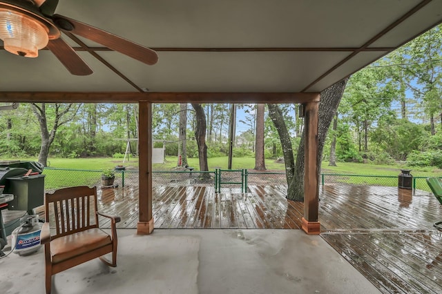 12626 Woodcreek Dr, Willis, TX 77318 - view of patio / terrace with view of wooded area and ceiling fan