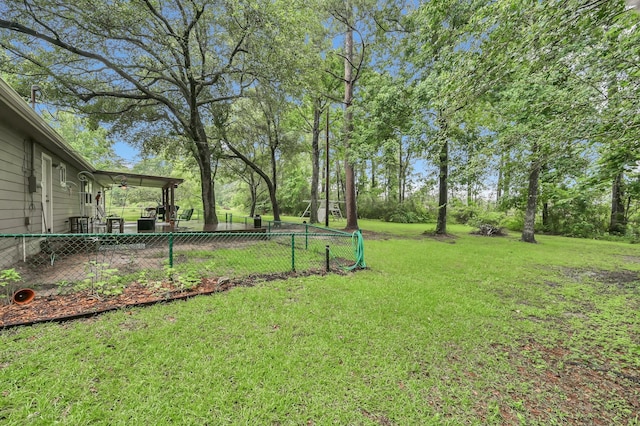 12626 Woodcreek Dr, Willis, TX 77318 - view of yard featuring ceiling fan