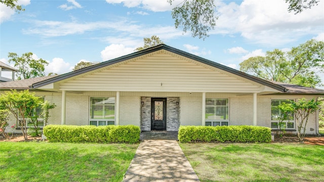 14227 Indian Wells Dr, Houston, TX 77069 - view of front facade featuring brick siding and a front yard