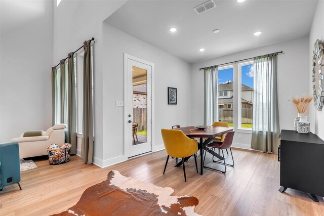9219 Trimble Landing Dr, Tomball, TX 77375 - dining room with light wood finished floors and recessed lighting