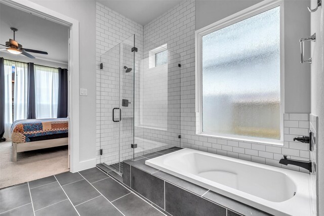 9219 Trimble Landing Dr, Tomball, TX 77375 - ensuite bathroom featuring a bath, a stall shower, tile patterned floors, and ceiling fan