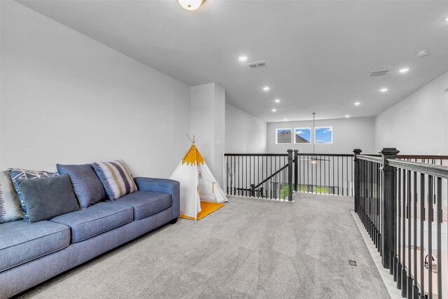 9219 Trimble Landing Dr, Tomball, TX 77375 - sitting room with carpet floors, recessed lighting, and an upstairs landing