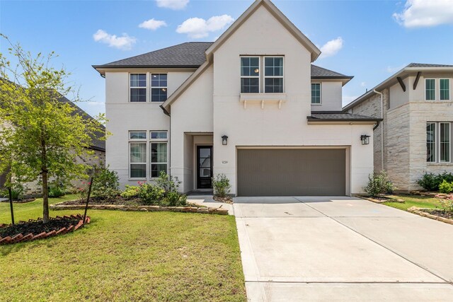 9219 Trimble Landing Dr, Tomball, TX 77375 - view of front of home featuring stucco siding, a garage, a front yard, concrete driveway, and a shingled roof
