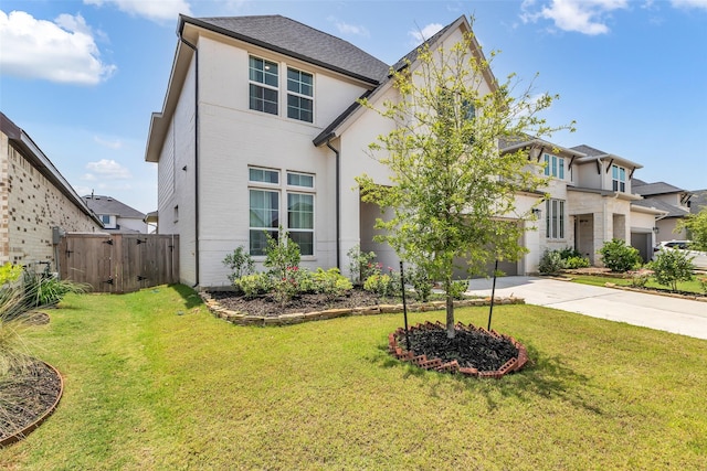 9219 Trimble Landing Dr, Tomball, TX 77375 - view of front facade featuring concrete driveway, a residential view, a garage, stucco siding, and a gate