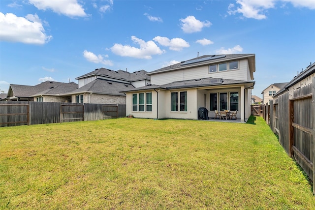 9219 Trimble Landing Dr, Tomball, TX 77375 - back of property featuring a fenced backyard, solar panels, and a patio area