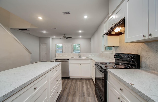 8718 Scott St Unit A B, Houston, TX 77051 - kitchen with dishwasher, black range with electric stovetop, decorative backsplash, white cabinets, and recessed lighting
