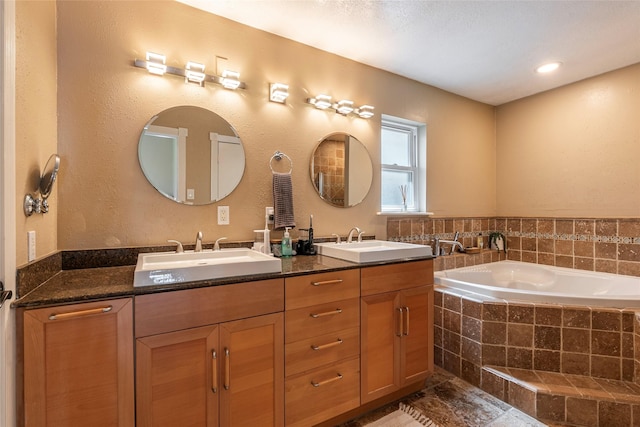 1417 S Heron Dr, Seabrook, TX 77586 - bathroom featuring double vanity and a bath