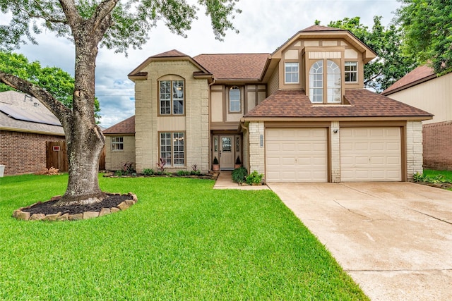 1417 S Heron Dr, Seabrook, TX 77586 - view of front of property featuring roof with shingles, concrete driveway, a front yard, and brick siding
