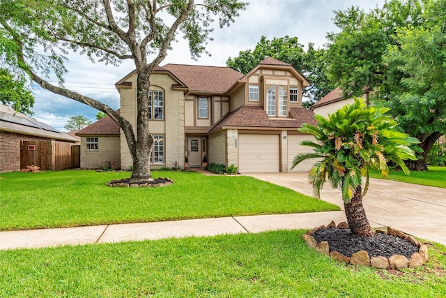 1417 S Heron Dr, Seabrook, TX 77586 - english style home featuring concrete driveway, roof with shingles, a garage, and brick siding
