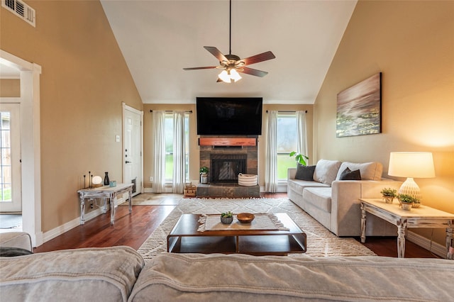 1417 S Heron Dr, Seabrook, TX 77586 - living area with ceiling fan, wood finished floors, a fireplace with raised hearth, and high vaulted ceiling