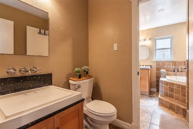 1417 S Heron Dr, Seabrook, TX 77586 - full bath with a garden tub, vanity, and a textured wall