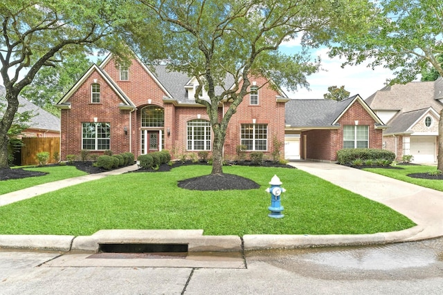14210 Hansons Creek Ct, Houston, TX 77044 - traditional home with brick siding, concrete driveway, roof with shingles, and an attached garage