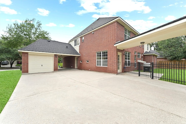 14210 Hansons Creek Ct, Houston, TX 77044 - view of home's exterior featuring brick siding, concrete driveway, an attached garage, and a shingled roof