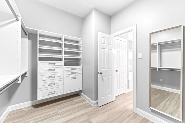 14210 Hansons Creek Ct, Houston, TX 77044 - walk in closet featuring light wood-type flooring