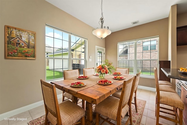 14210 Hansons Creek Ct, Houston, TX 77044 - dining room featuring baseboards and light tile patterned floors