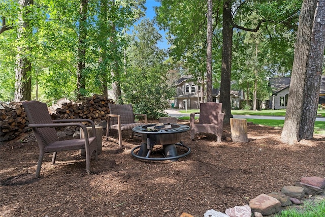 248 S Pathfinders Cir, The Woodlands, TX 77381 - view of yard with a fire pit