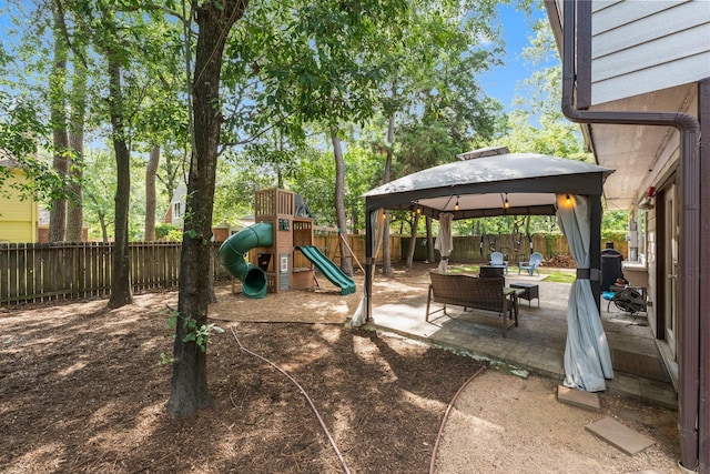 248 S Pathfinders Cir, The Woodlands, TX 77381 - view of play area with a fenced backyard, a gazebo, and a patio