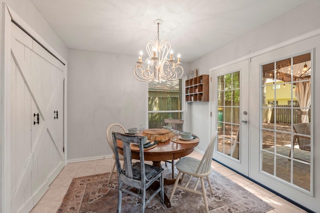248 S Pathfinders Cir, The Woodlands, TX 77381 - dining room with french doors, a chandelier, and light tile patterned floors