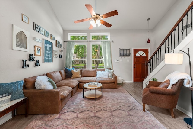 248 S Pathfinders Cir, The Woodlands, TX 77381 - living area with wood finished floors, ceiling fan, stairs, and lofted ceiling