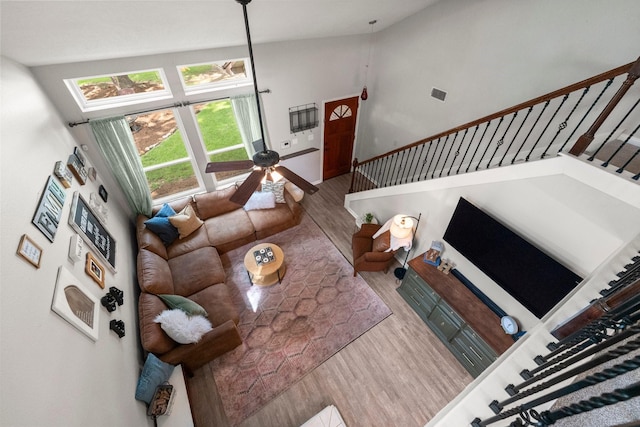 248 S Pathfinders Cir, The Woodlands, TX 77381 - living room with wood finished floors, stairs, and high vaulted ceiling