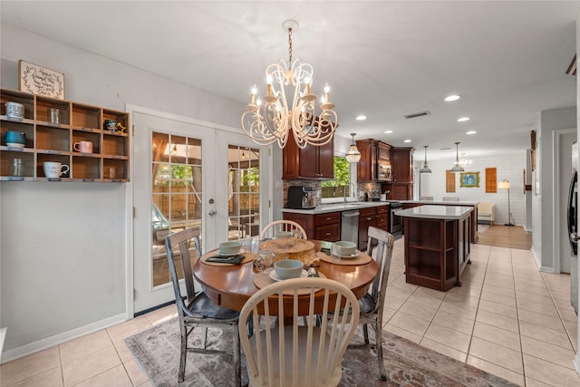 248 S Pathfinders Cir, The Woodlands, TX 77381 - dining room with a chandelier, light tile patterned floors, french doors, and recessed lighting