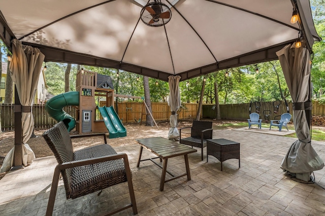 248 S Pathfinders Cir, The Woodlands, TX 77381 - fenced backyard featuring a gazebo, a playground, and a patio