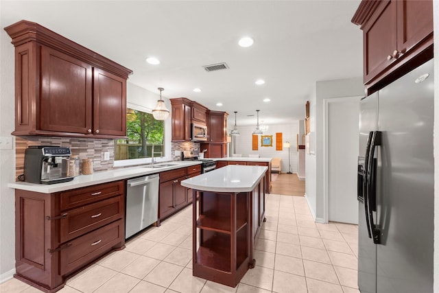 248 S Pathfinders Cir, The Woodlands, TX 77381 - kitchen featuring stainless steel appliances, a peninsula, light countertops, tasteful backsplash, and open shelves