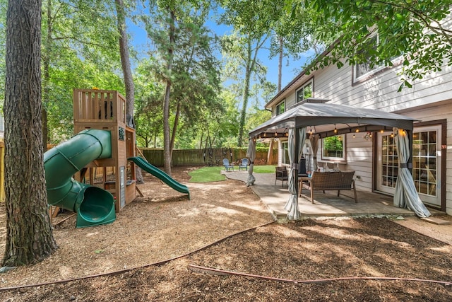 248 S Pathfinders Cir, The Woodlands, TX 77381 - view of yard featuring a gazebo, a patio, and a playground