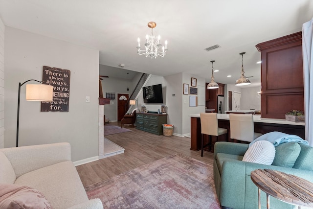 248 S Pathfinders Cir, The Woodlands, TX 77381 - living room featuring light wood-type flooring, a chandelier, and recessed lighting