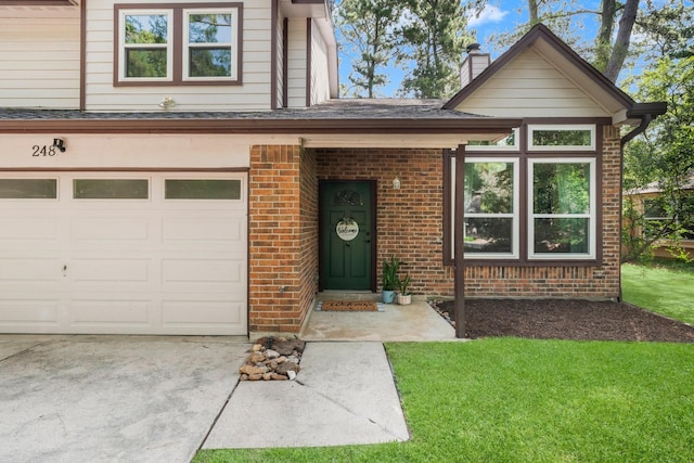 248 S Pathfinders Cir, The Woodlands, TX 77381 - view of front of house with brick siding, a garage, a chimney, a front yard, and concrete driveway