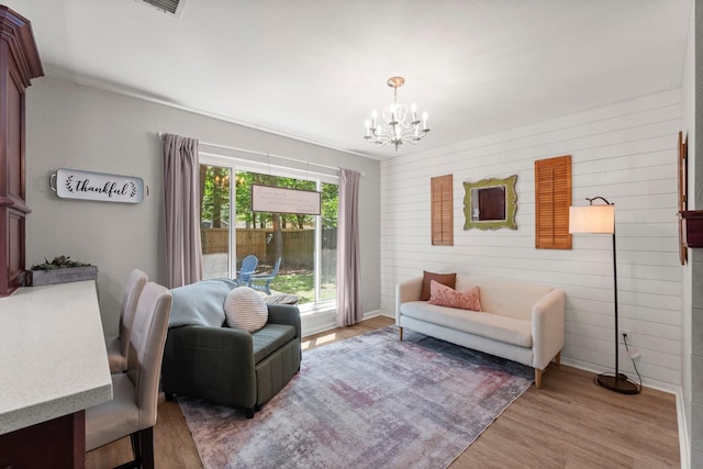 248 S Pathfinders Cir, The Woodlands, TX 77381 - living room featuring a chandelier, wood finished floors, and wood walls
