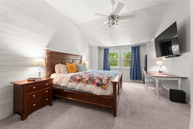 248 S Pathfinders Cir, The Woodlands, TX 77381 - bedroom with lofted ceiling, light carpet, a ceiling fan, and wood walls