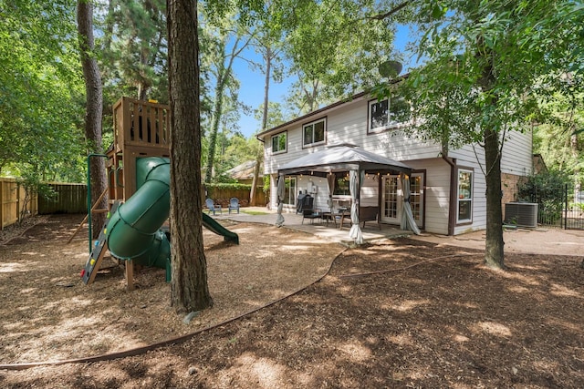 248 S Pathfinders Cir, The Woodlands, TX 77381 - back of property featuring a gazebo, a fenced backyard, a patio area, and a playground