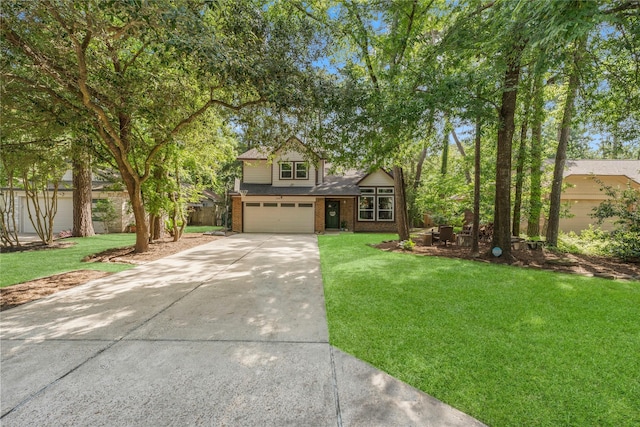 248 S Pathfinders Cir, The Woodlands, TX 77381 - view of front of house featuring driveway, an attached garage, a front yard, and brick siding