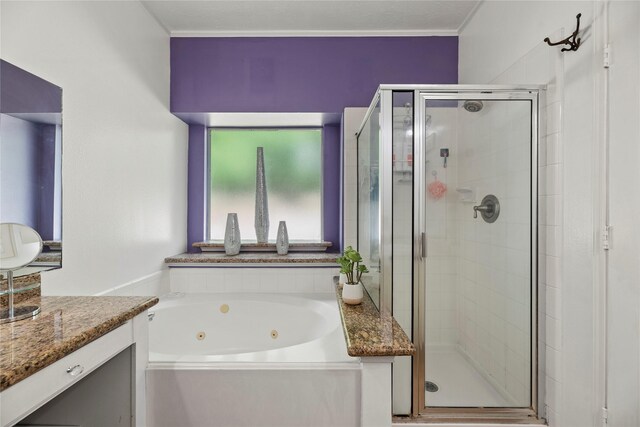 17706 Riata Lake Dr, Cypress, TX 77433 - bathroom featuring a tub with jets, a shower stall, and vanity