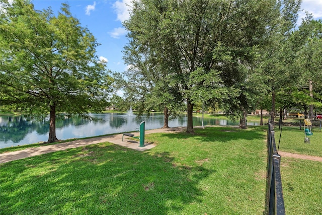 17706 Riata Lake Dr, Cypress, TX 77433 - view of home's community with a yard and a water view