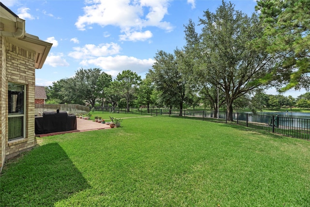 17706 Riata Lake Dr, Cypress, TX 77433 - fenced backyard with a water view